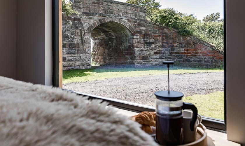 Crail Holiday lodge under railway bridge